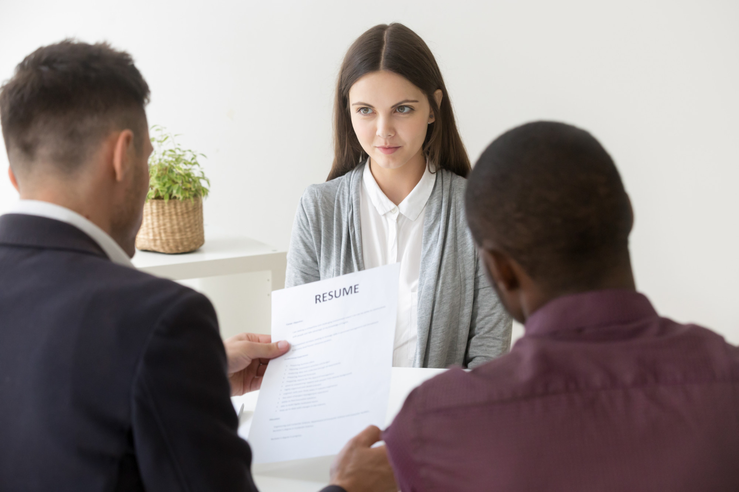 multiracial-hr-reading-resume-millennial-job-applicant-interview